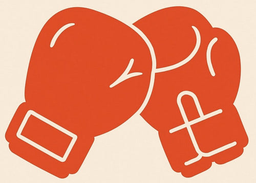 Red boxing gloves on a beige background